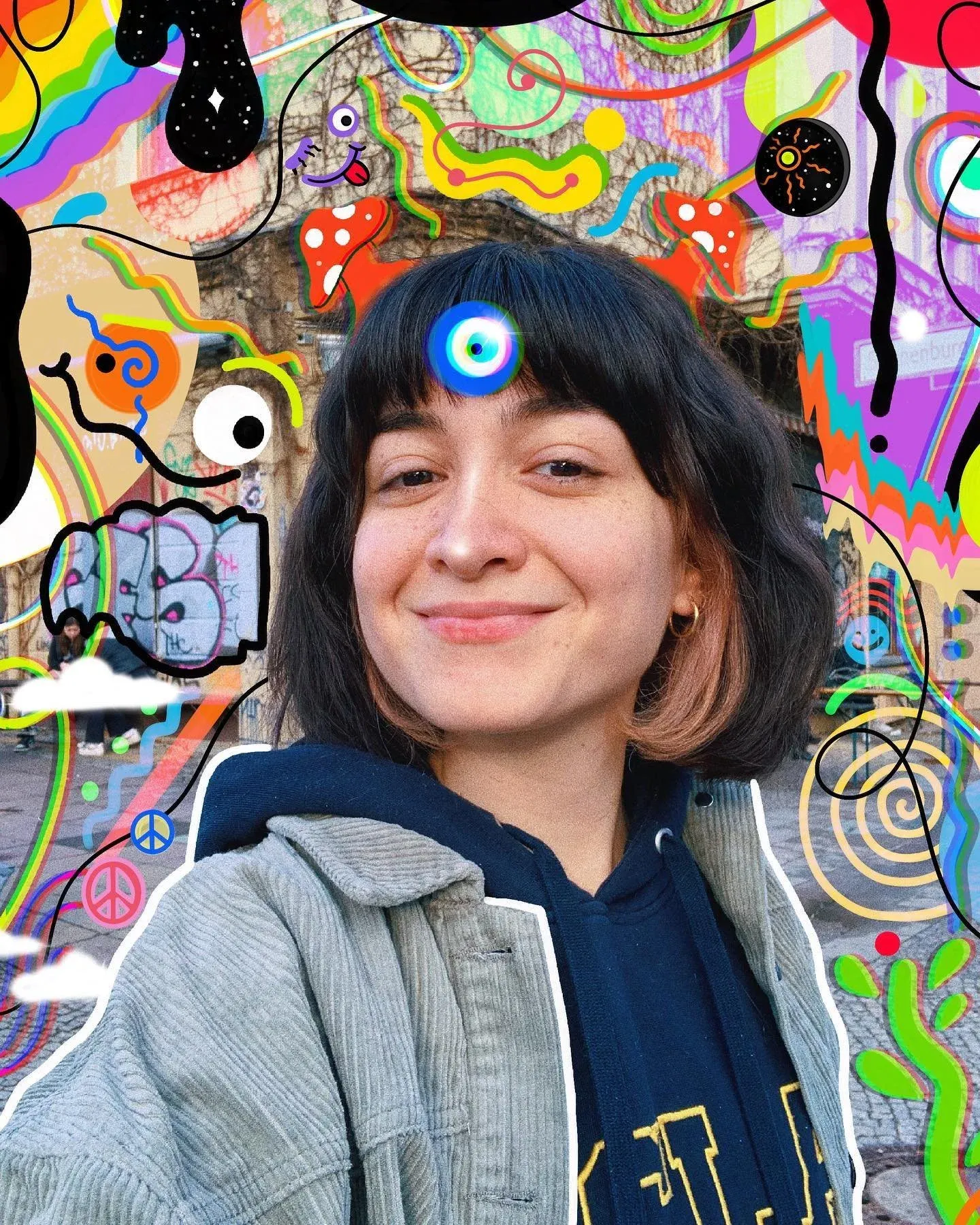 Sarah Slik, the artist behind SLIKODELICS, in front of her mural